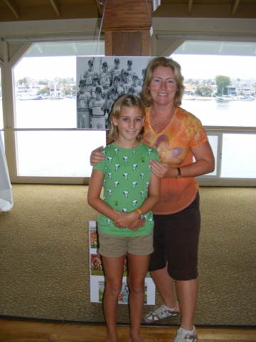 Katrin Hecht Bandhauer and daughter, Lorien, decorating the Pavilion with their enlarged team and club photos
